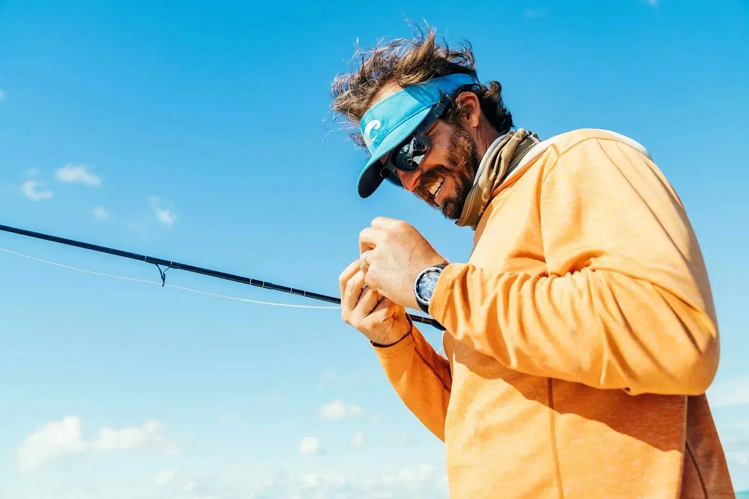 Kyle rigging a fly rod on the flats